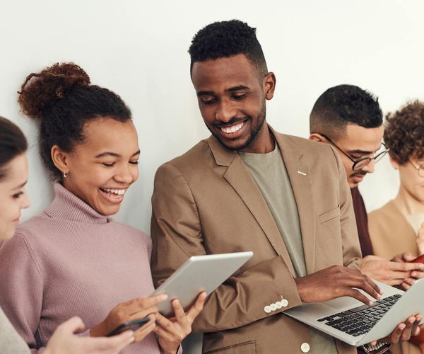 Group of diverse women chatting and smiling together.